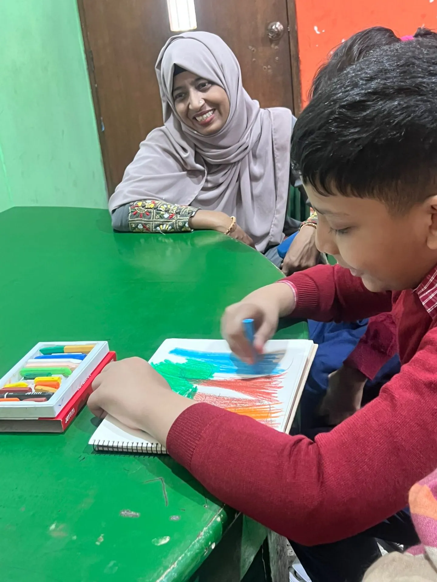 Boy at the table playing