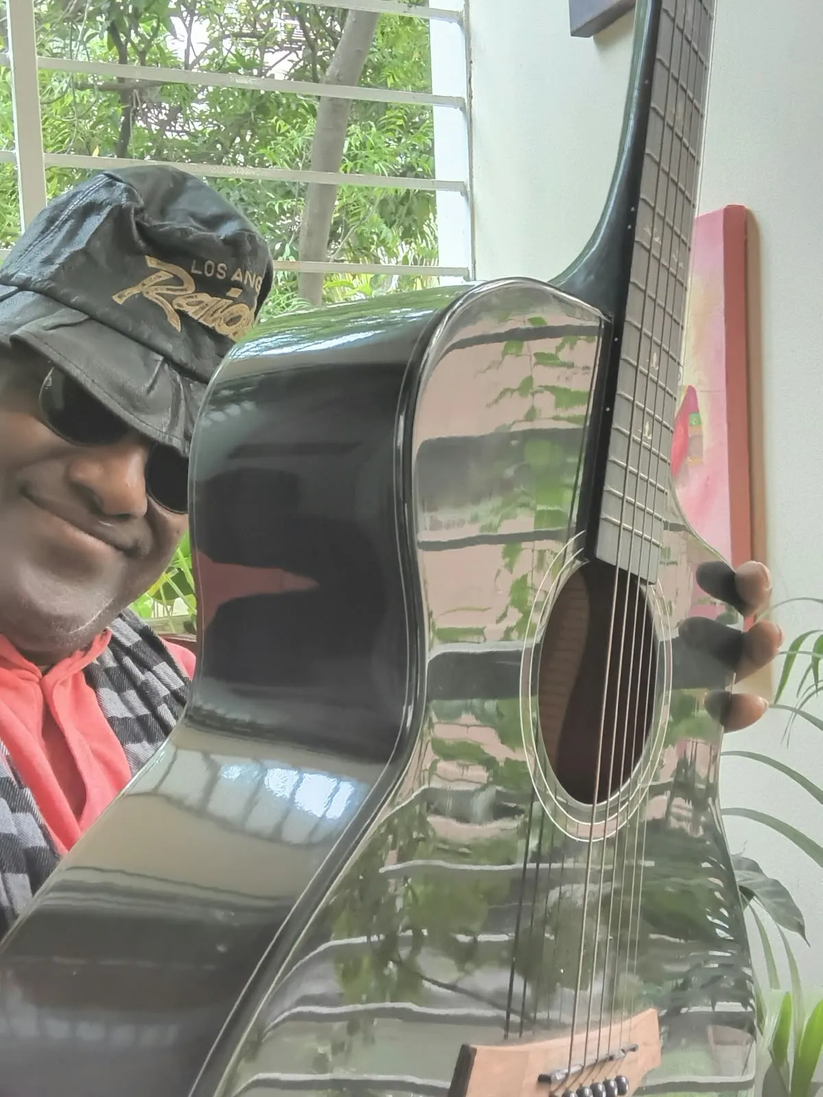 The Chairman with an acoustic guitar
